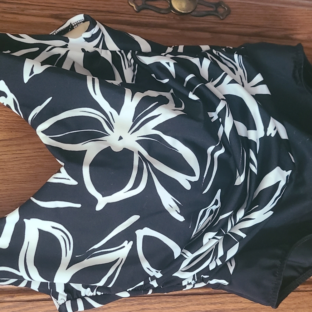 Black and White Floral Swimsuit Miracle Suit Size 14 . Lightly Used.